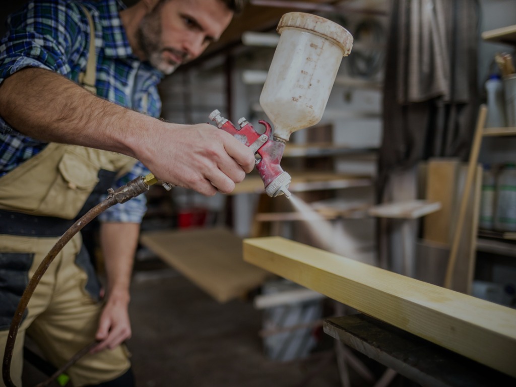 Carpenter with spray gun